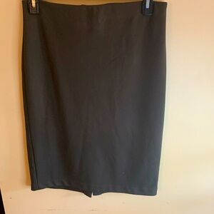 Olive green pencil skirt. Zip back and back slit. Dress up or down for any occas